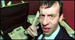 A man in an office on the phone